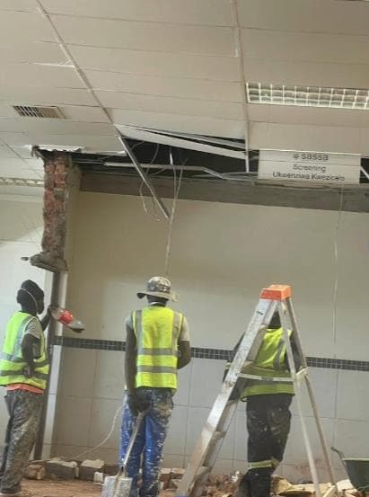 Professional hair stylist meticulously working on a client's hair.